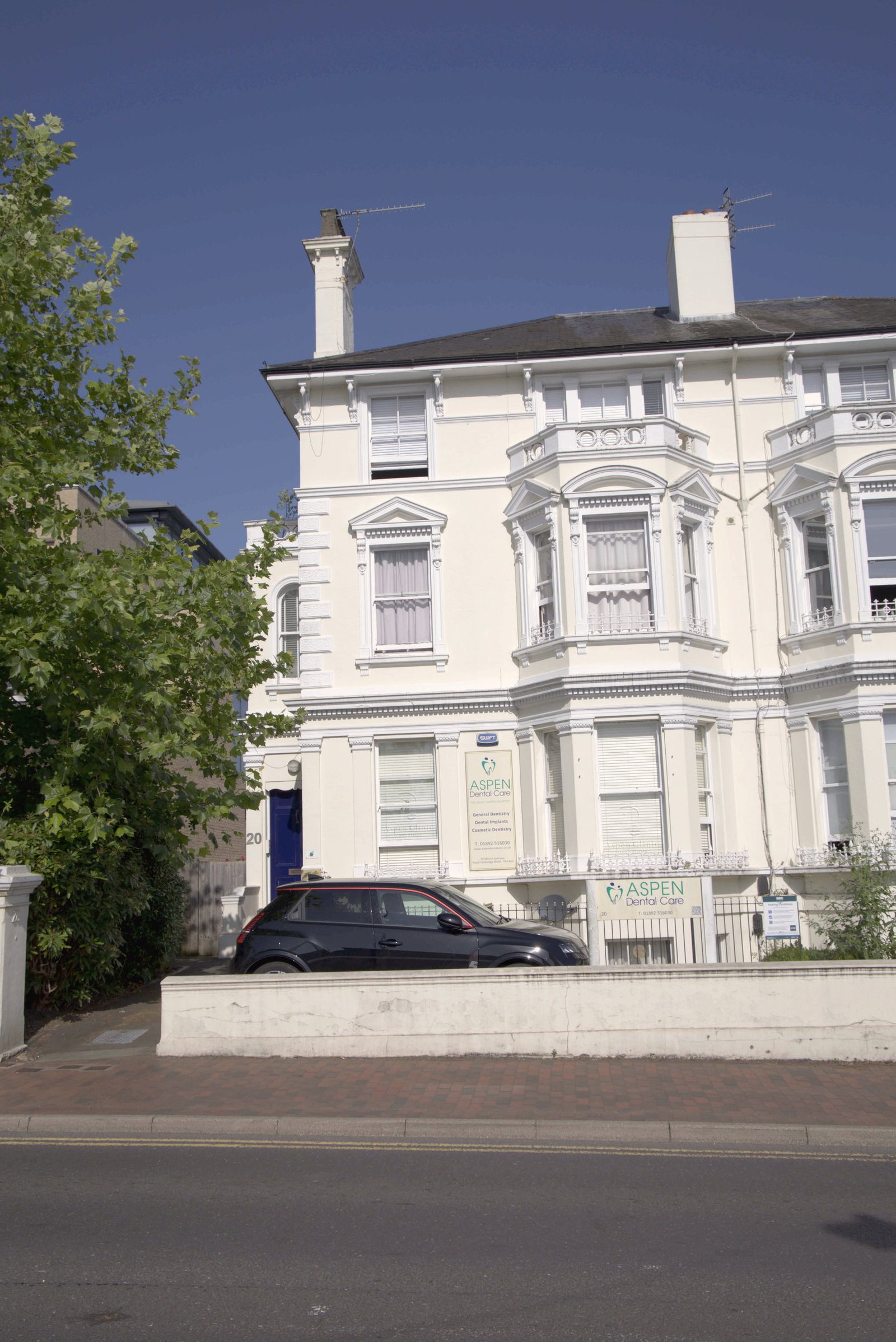 Front of Aspen Dental Care with a patient parking bay, 20 Mount Ephraim