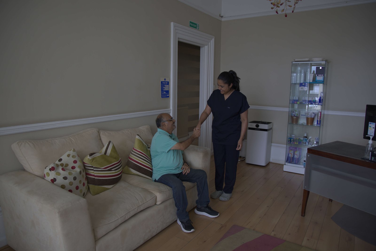 Nurse welcoming a patient in the Aspen Dental Care reception