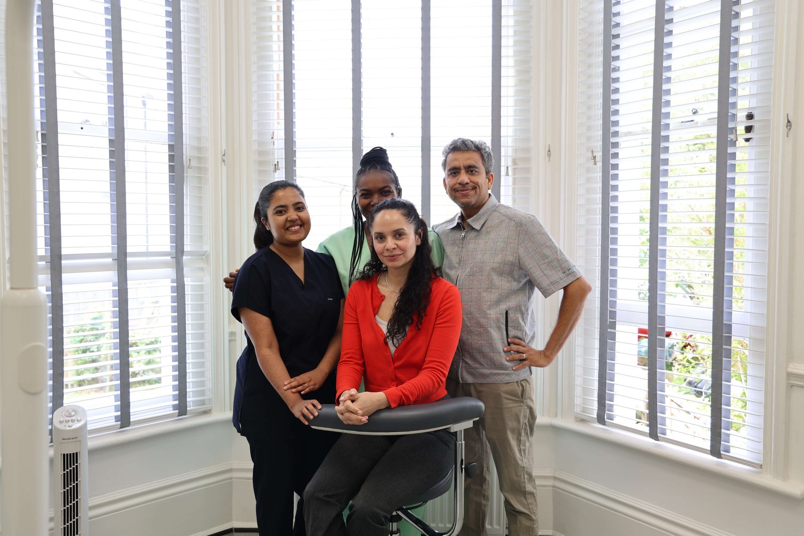 The Aspen Dental Care team — dentist and nurses